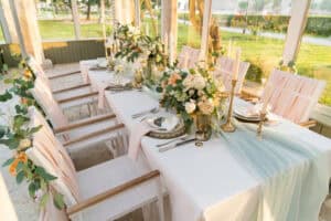Wedding banquet table set with florals